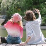 Bulldog - A Couple Taking Their Own Photo with a Smartphone