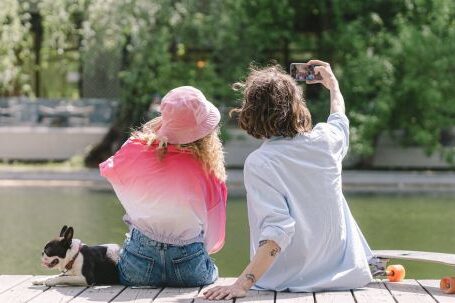 Bulldog - A Couple Taking Their Own Photo with a Smartphone